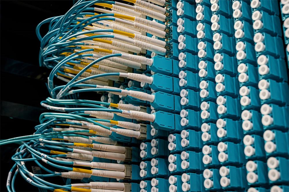 Fiber optic patch cables in a telecommunications rack
